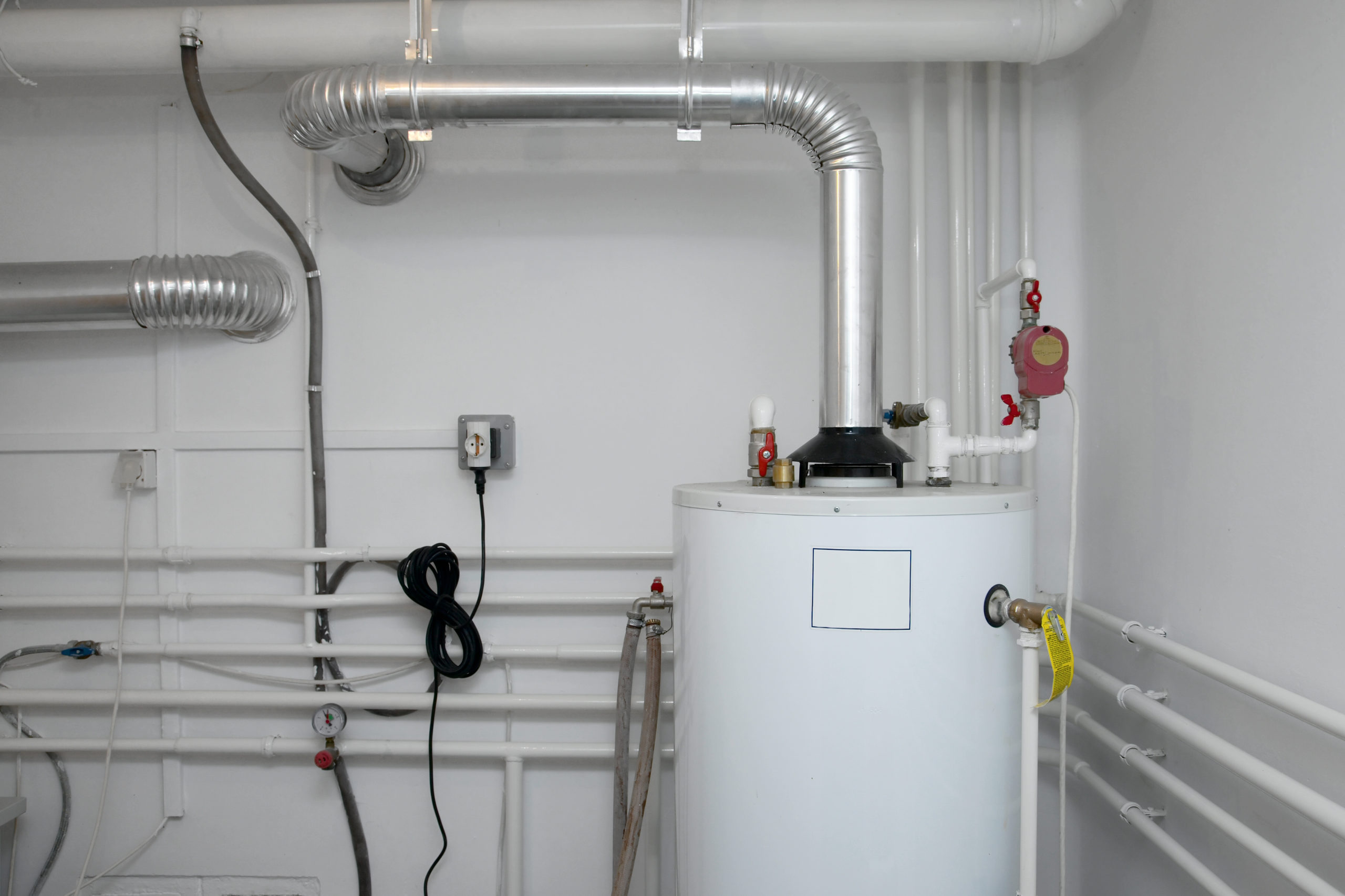 Image of a boiler in a backroom in the color white