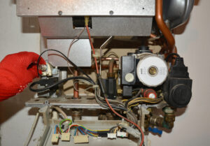 Repair of a gas boiler, setting up and servicing gas boiler by repairman